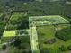 Aerial view of property outlining land, showcasing the lush greenery and surrounding landscape at 250 Friendship Church Rd, Brooks, GA 30205