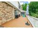 Expansive outdoor deck showcases wooded views, outdoor kitchen, and screened in porch at 250 Friendship Church Rd, Brooks, GA 30205