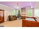 Finished basement area featuring a daybed, sitting area and nice windows for natural light at 250 Friendship Church Rd, Brooks, GA 30205