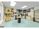 Finished basement area that could be used as an art studio or craft area at 250 Friendship Church Rd, Brooks, GA 30205