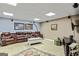 Finished basement with leather seating and a TV at 250 Friendship Church Rd, Brooks, GA 30205
