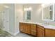 Bathroom with a double sink vanity, quartz countertop, and illuminated mirrors at 250 Friendship Church Rd, Brooks, GA 30205