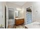 Bathroom with a wood vanity, granite countertop, and a separate room with a shower and toilet at 250 Friendship Church Rd, Brooks, GA 30205