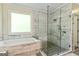 Luxurious bathroom featuring a soaking tub and a glass-enclosed shower at 250 Friendship Church Rd, Brooks, GA 30205