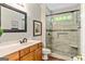 Updated bathroom featuring a large shower with a bench seat and a stylish vanity at 250 Friendship Church Rd, Brooks, GA 30205