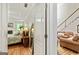 Bedroom doorway with an adjacent view of the living room and staircase at 250 Friendship Church Rd, Brooks, GA 30205
