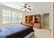 Bedroom with a ceiling fan and built in shelving near a window at 250 Friendship Church Rd, Brooks, GA 30205