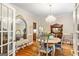 Dining room with hardwood floors, chandelier, and decorative furniture at 250 Friendship Church Rd, Brooks, GA 30205