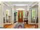 Elegant foyer with hardwood floors, a decorative rug, and doors leading to other rooms at 250 Friendship Church Rd, Brooks, GA 30205