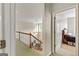 Upstairs hallway that looks over the railing, with bedrooms visible from the doors at 250 Friendship Church Rd, Brooks, GA 30205