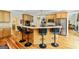 Stylish kitchen featuring wood floors, stainless steel appliances, and a counter with bar stool seating at 250 Friendship Church Rd, Brooks, GA 30205