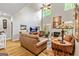Bright living room with high ceilings, fireplace, hardwood floors, and ample seating at 250 Friendship Church Rd, Brooks, GA 30205