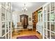 Cozy living room with hardwood floors, elegant furniture, and French doors at 250 Friendship Church Rd, Brooks, GA 30205