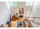 Bright living room with hardwood floors, fireplace, leather furniture, and two-story windows at 250 Friendship Church Rd, Brooks, GA 30205