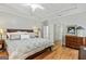 Main bedroom featuring a trey ceiling, hardwood floors, and decorative furniture at 250 Friendship Church Rd, Brooks, GA 30205