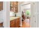 Butler's pantry featuring wood cabinets, a countertop, and access to other rooms in the home at 250 Friendship Church Rd, Brooks, GA 30205