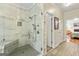 Modern shower with glass enclosure, bench, and beautiful tile work at 250 Friendship Church Rd, Brooks, GA 30205