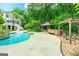 A gorgeous swimming pool is showcased along with an outdoor seating area and lush landscaping and foliage at 250 Friendship Church Rd, Brooks, GA 30205