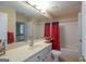 Bathroom with a single sink vanity, a large mirror and a shower and tub combo at 168 Maple Grove Ter, Peachtree City, GA 30269