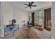 Cozy bedroom with a ceiling fan, neutral walls, and a large window for plenty of light at 168 Maple Grove Ter, Peachtree City, GA 30269