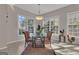 Sunlit dining area with large windows and tile floors offers a cozy space at 168 Maple Grove Ter, Peachtree City, GA 30269