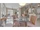 Bright dining room features natural light, tile flooring, and access to outdoor living at 168 Maple Grove Ter, Peachtree City, GA 30269