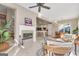Open-concept living room with fireplace and sightlines to the kitchen and dining areas at 168 Maple Grove Ter, Peachtree City, GA 30269