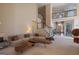 Bright and spacious living room boasts high ceilings and comfortable seating at 168 Maple Grove Ter, Peachtree City, GA 30269