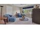 Spacious living room with comfortable seating, a window, and neutral carpet at 168 Maple Grove Ter, Peachtree City, GA 30269