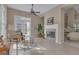 Relaxing living room with a fireplace and access to the backyard through french doors at 168 Maple Grove Ter, Peachtree City, GA 30269