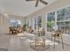 Expansive living space with ample natural light and connecting dining area at 168 Maple Grove Ter, Peachtree City, GA 30269
