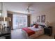 Bright main bedroom with ceiling fan, French doors to deck, and neutral walls at 168 Maple Grove Ter, Peachtree City, GA 30269