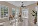 Cozy sunroom with tile floors, ceiling fan, and french doors to the exterior at 168 Maple Grove Ter, Peachtree City, GA 30269