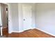 Bright bedroom with hardwood floors, closet, and convenient electrical outlets at 410 Oakpark Ter, Mcdonough, GA 30253