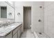 Modern bathroom with granite countertop, tiled shower, and chrome fixtures at 234 Kenilworth Cir, Stone Mountain, GA 30083
