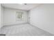 Bright bedroom with neutral carpet, natural light, and simple trim at 234 Kenilworth Cir, Stone Mountain, GA 30083