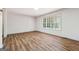 Bright bedroom with hardwood floors and a large window, creating a warm atmosphere at 234 Kenilworth Cir, Stone Mountain, GA 30083