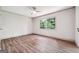Bedroom featuring wood flooring, ceiling fan, and natural light at 234 Kenilworth Cir, Stone Mountain, GA 30083