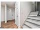 Inviting entryway with hard wood floors and carpeted stairs at 234 Kenilworth Cir, Stone Mountain, GA 30083