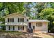Charming two-story home featuring neutral siding, wood shutters, and a cozy front porch at 234 Kenilworth Cir, Stone Mountain, GA 30083