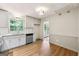 Bright kitchen with white cabinetry, stone countertops and stainless steel appliances at 234 Kenilworth Cir, Stone Mountain, GA 30083