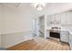 Modern kitchen with stainless steel appliances, white cabinets, granite countertop, and white backsplash at 234 Kenilworth Cir, Stone Mountain, GA 30083