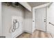 Unfinished laundry room featuring utility hookups, vinyl flooring, and exterior door at 234 Kenilworth Cir, Stone Mountain, GA 30083