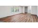 Spacious living room with hardwood floors, bright windows, and neutral paint at 234 Kenilworth Cir, Stone Mountain, GA 30083