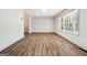 Bright living room boasting laminate flooring and a large picture window providing ample natural light at 234 Kenilworth Cir, Stone Mountain, GA 30083