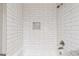 White tiled shower over tub combination with unique inlay design at 234 Kenilworth Cir, Stone Mountain, GA 30083