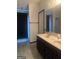 Bright bathroom with dual sink vanity, large mirror, and walk-in shower at 393 Macland Dr, Lawrenceville, GA 30045