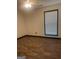 This bedroom has wood-look flooring and a window for natural light at 393 Macland Dr, Lawrenceville, GA 30045