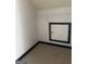 Walk-in closet featuring carpet flooring, white shelving, and dark trim at 393 Macland Dr, Lawrenceville, GA 30045