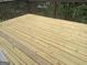 New, wooden deck with railing overlooking foliage at 393 Macland Dr, Lawrenceville, GA 30045